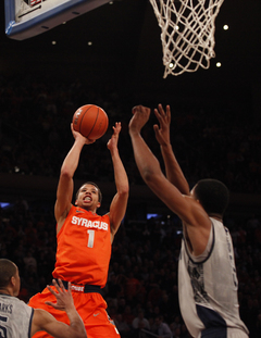 Michael Carter-Williams makes a shot in the paint.