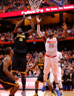 SU forward Rakeem Christmas waits with Owls center Willy Kouassi for a ball to come off the boards.