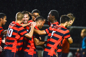 Syracuse celebrates one of its two goals on Tuesday night against Colgate. SU improved to 6-2-1 on the year.