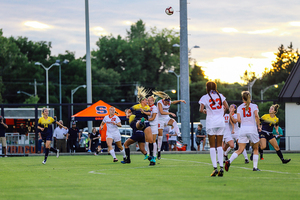 Syracuse players contest for a header against Kent State on Sept. 13. SU lost, 2-1.