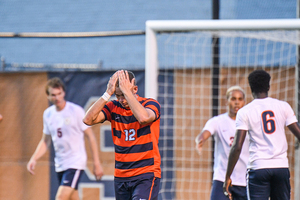 John-Austin Ricks puts his hand over his head in SU's loss to Virginia earlier this season. The Orange snapped a six-game streak without a loss Tuesday night.