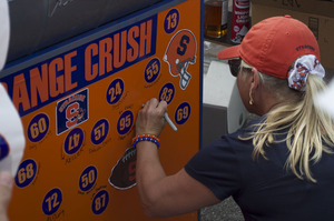 The DeMetro tailgate has even attracted some Syracuse football players' parents to its racing trailer. 