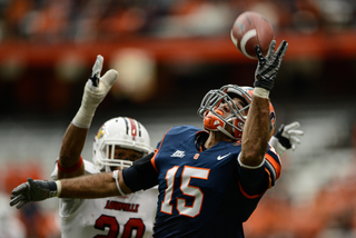 Alec Lemon attempts to haul in a pass over his shoulder.