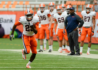 Jeremiah Kobena runs upfield after catching a screen pass. Kobena hauled in two touchdowns to lead the Orange offense to a 34-27 win against the defense.