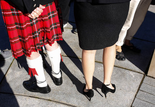 A Scottish Lockerbie representative and a Remembrance Scholar stand in front of the Hall of Languages.