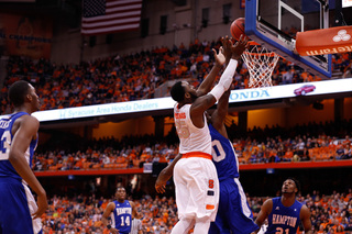 Christmas fights for the ball with Pressley as it comes off the rim.