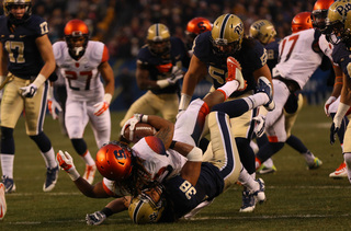 Gulley is tackled by Panthers defensive back Ryan Lewis.