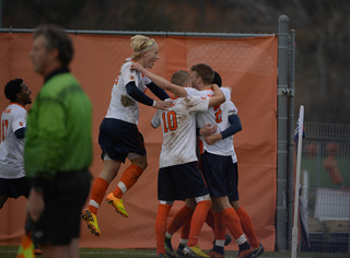 Ekblom celebrates with his teammates after Alseth's goal gave SU a 2-1 lead.