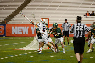 Rice extends his arm out in an attempt to secure a loose ball.