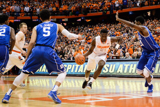 Roberson attempts to split Jefferson and point guard Tyus Jones (5) at the top of the key.