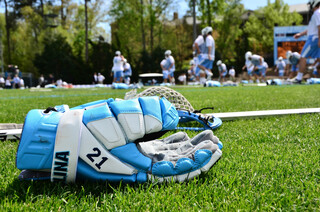 The glove of North Carolina midfielder Michael Tagliaferri lies on the grass at Fetzer Field before Saturday's game.