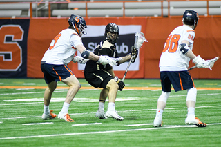 Andrew Helmer (right) defends on a possession. 