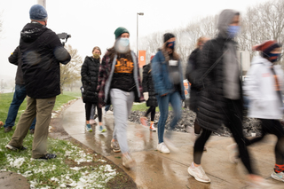 The women's cross country team walks from Skytop on South Campus to Coyne Stadium in support of Black equality.