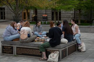 Students sit and relax while they eat their food and wait for the musical performances to start. Food trucks and activities began at 2 p.m., and Kinsley kicked off the show around 4 p.m. with her song ”Karma”.